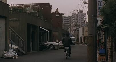 Final Explicado de Cure (1997): O Vazio que Contagia e a Anatomia do Mal fotografia urbana cinzenta filme cure kiyoshi kurosawa